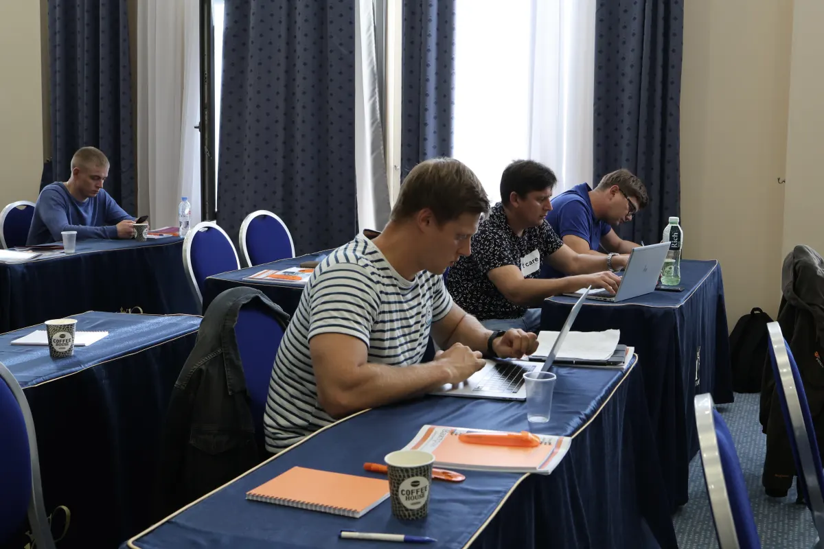 Participants working through practical course materials during VacMentor training