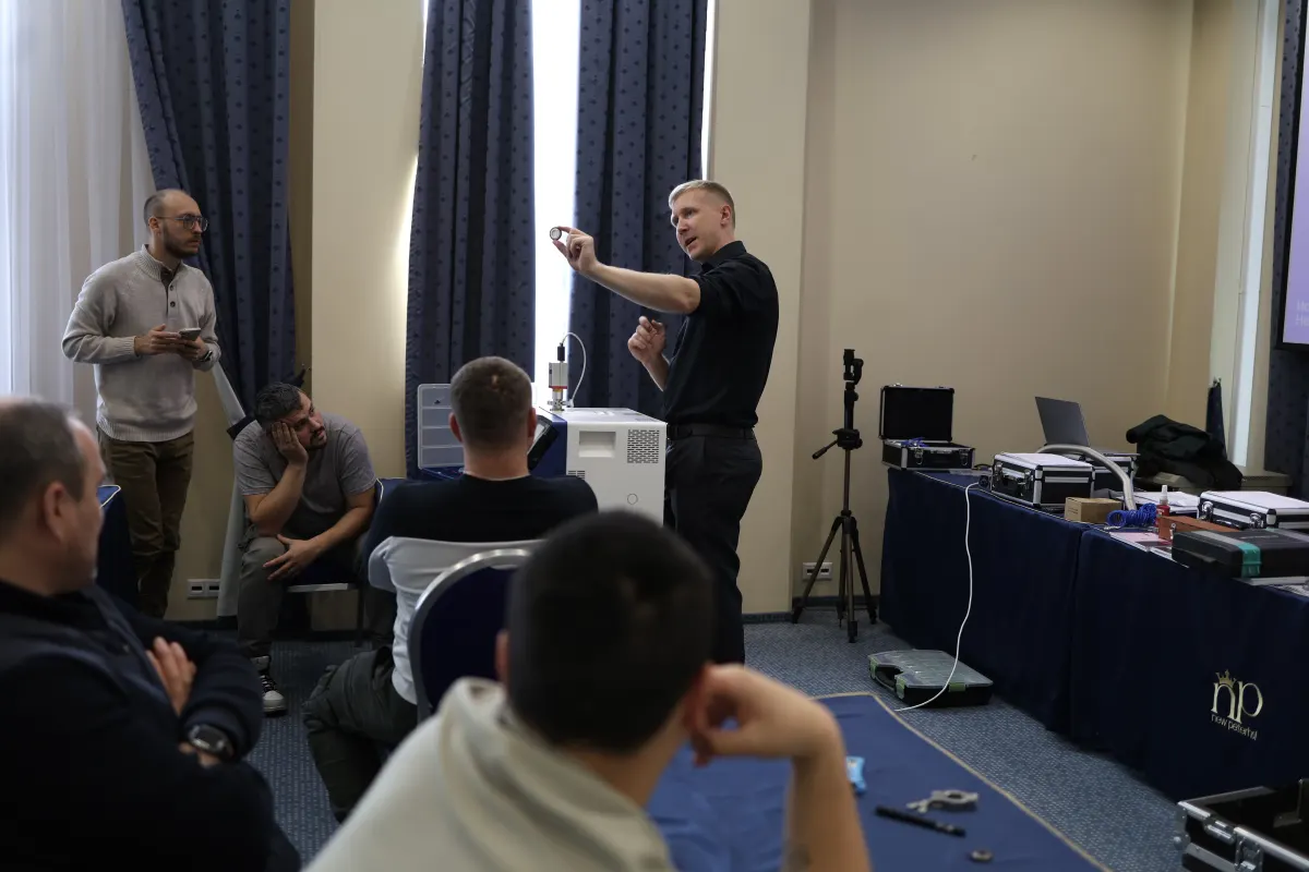 Helium leak detector operation practice during a VacMentor training course
