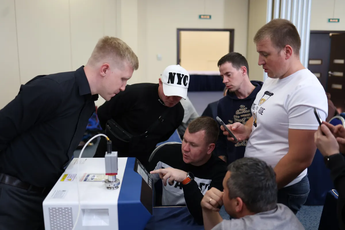 Helium leak detector operation practice during a VacMentor training course